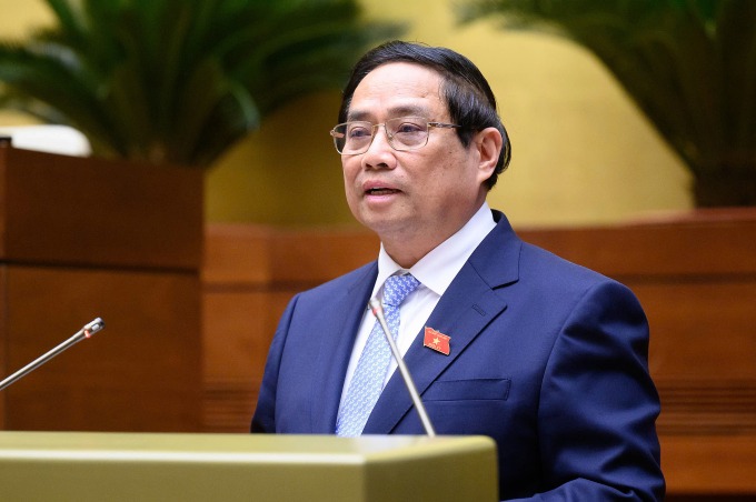 Thủ tướng Phạm Minh Chính báo cáo Quốc hội kết quả phát triển kinh tế xã hội, sáng 5/5. Ảnh: Cổng TTĐT Quốc hội